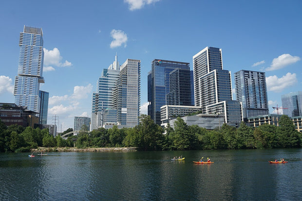 Austin skyline reflected in Lady Bird Lake, a popular Texas paddleboarding spot