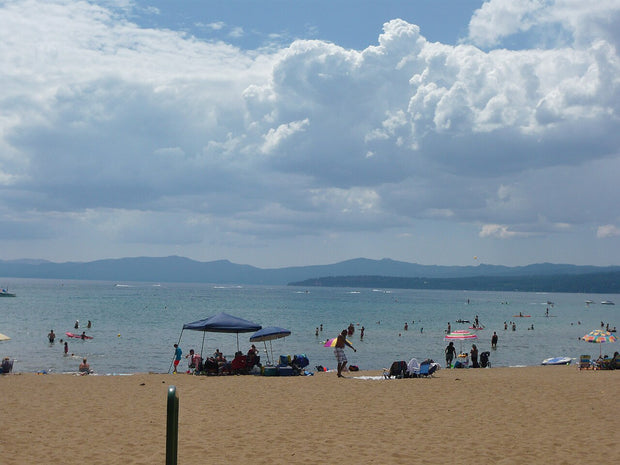 Clear blue water and a sand beach at Kings Beach State Recreation Area on Lake Tahoe, California