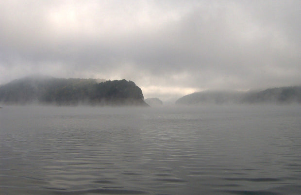 Fontana Lake at sunrise in North Carolina's Great Smoky Mountains, calm mountain reservoir for paddleboarding in the Blue Ridge