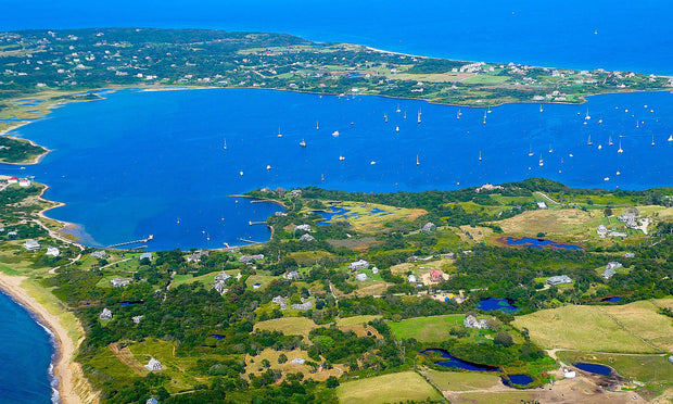 Great Salt Pond on Block Island, Rhode Island, a sheltered blue harbor dotted with sailboats and popular for paddleboarding