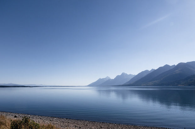 Jackson Lake at Grand Teton National Park, Wyoming, with the Teton Range reflected on calm water