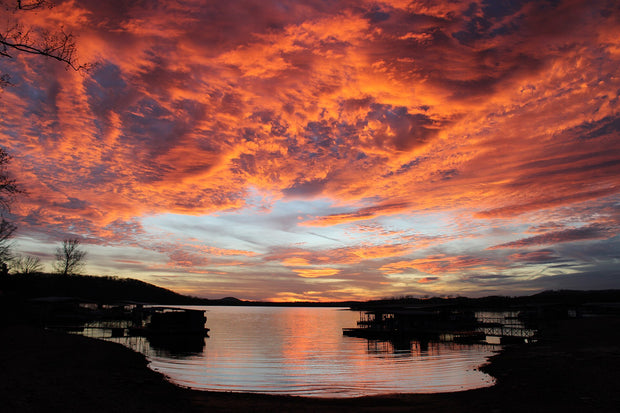 Table Rock Lake at sunset in the Ozarks of Missouri, calm water with forested shoreline
