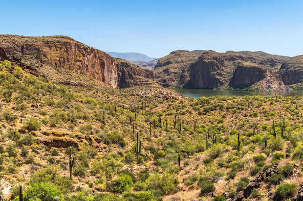 Canyon Lake on the Apache Trail near Phoenix, Arizona, red-rock desert canyon walls above calm blue paddling water