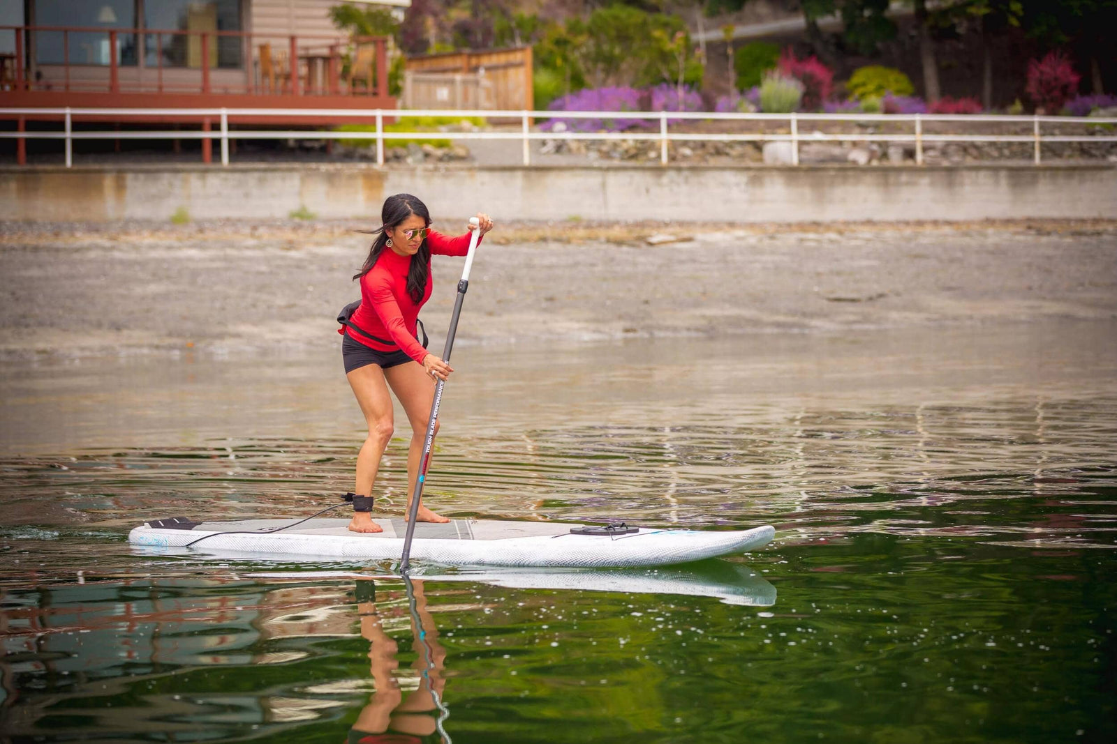 girl working out on a paddleboard