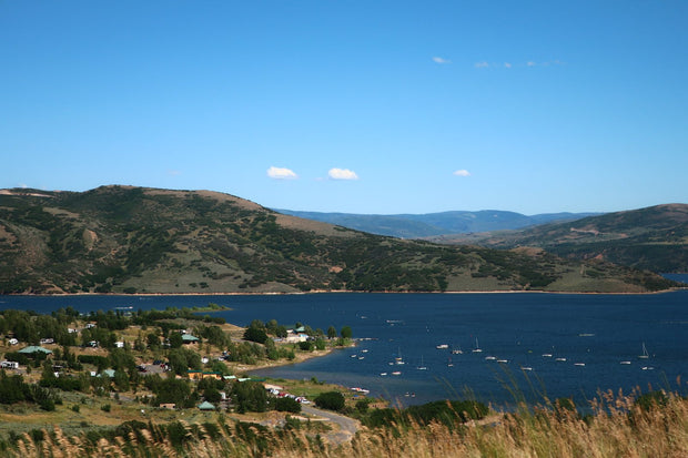 Jordanelle Reservoir near Park City, Utah, blue mountain water with boats, a popular Utah paddleboarding spot